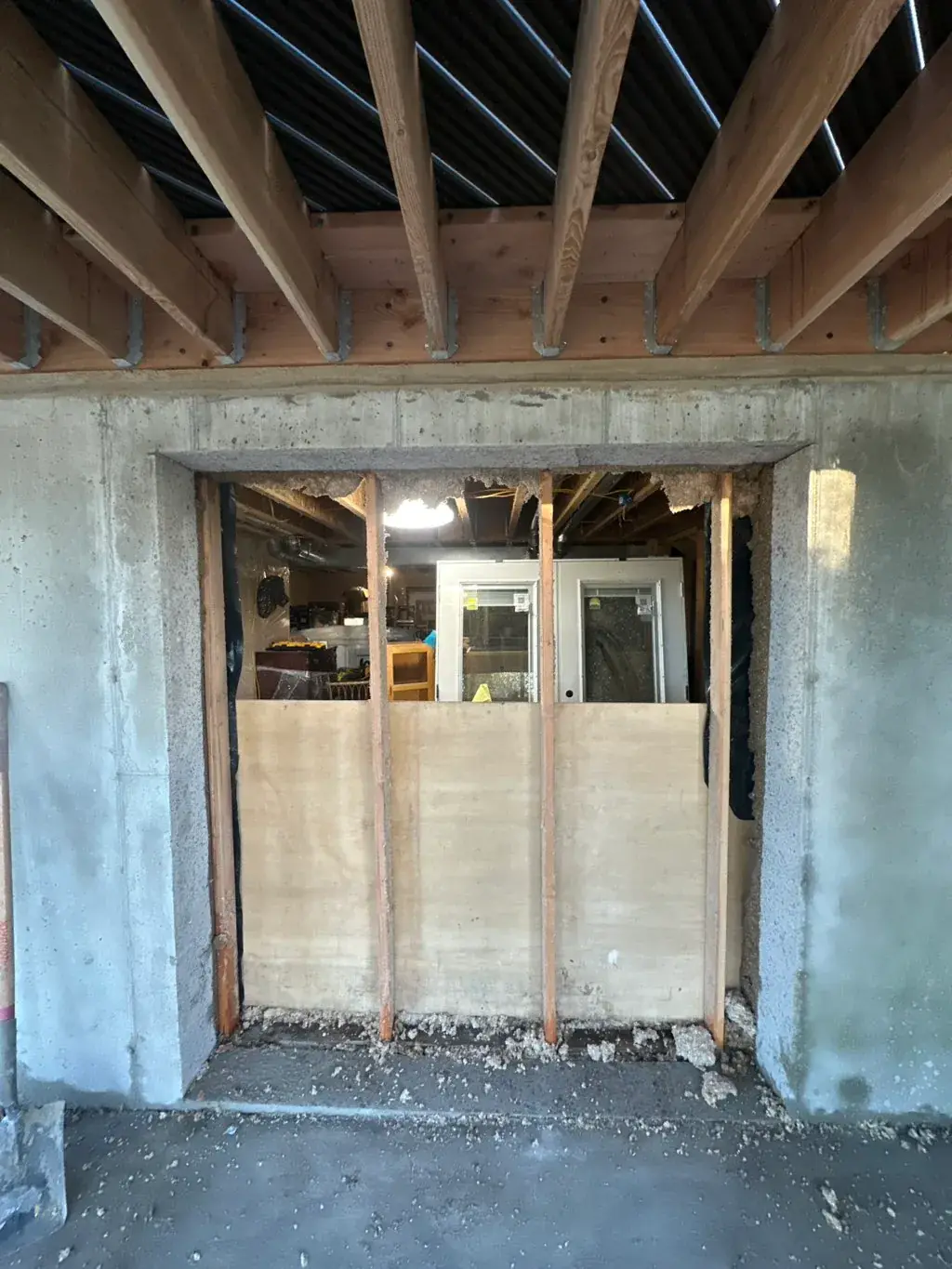 New door opening in a basement wall by MD Concrete in Utah