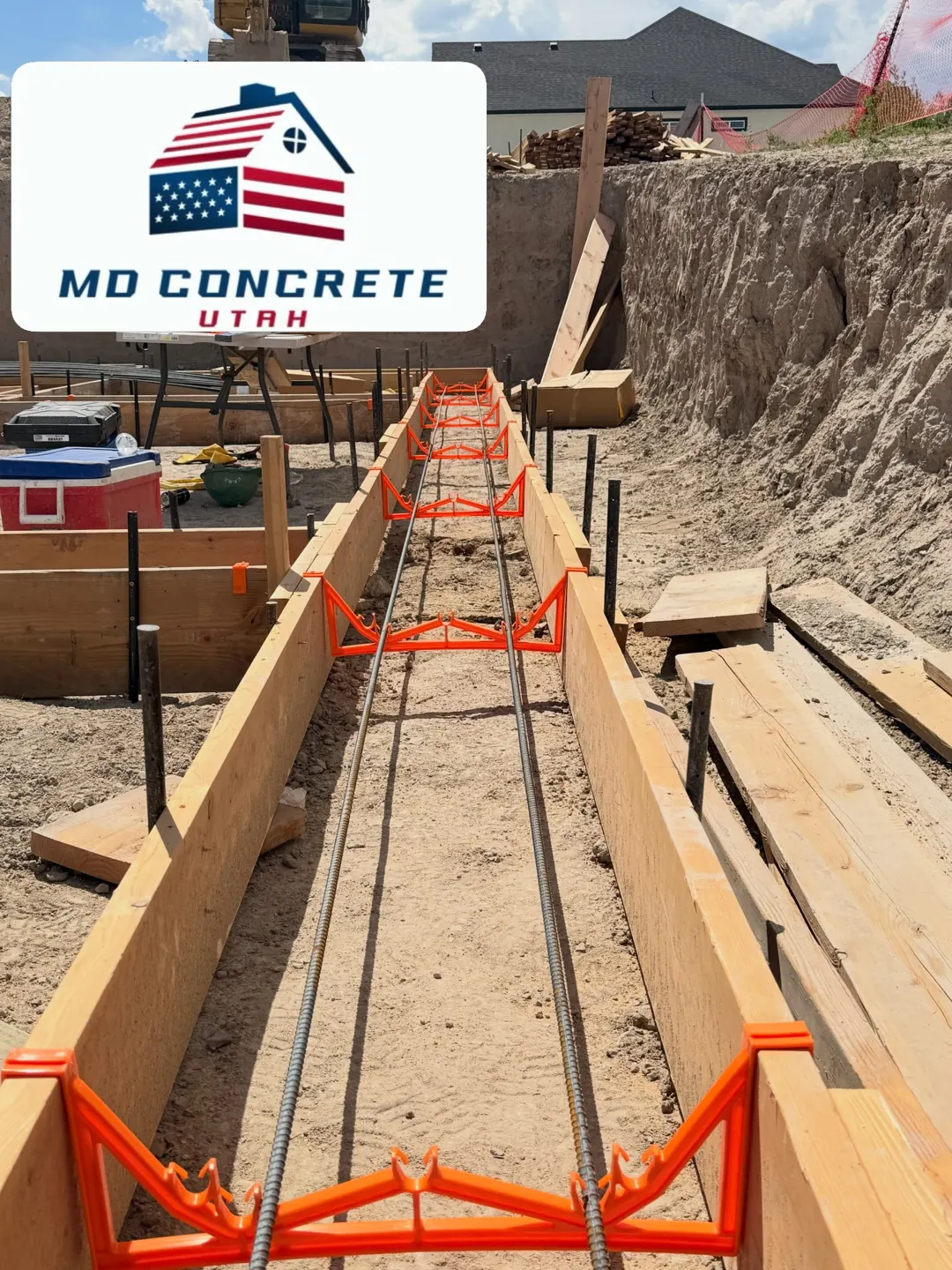 Rebar set inside footing forms by MD Concrete in Utah