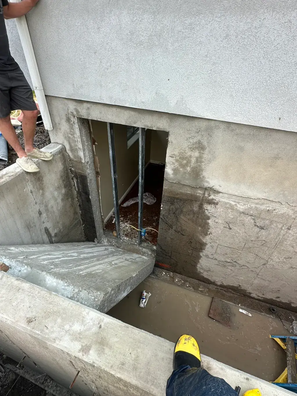 Wall cut open for a walkout door by MD Concrete in Utah