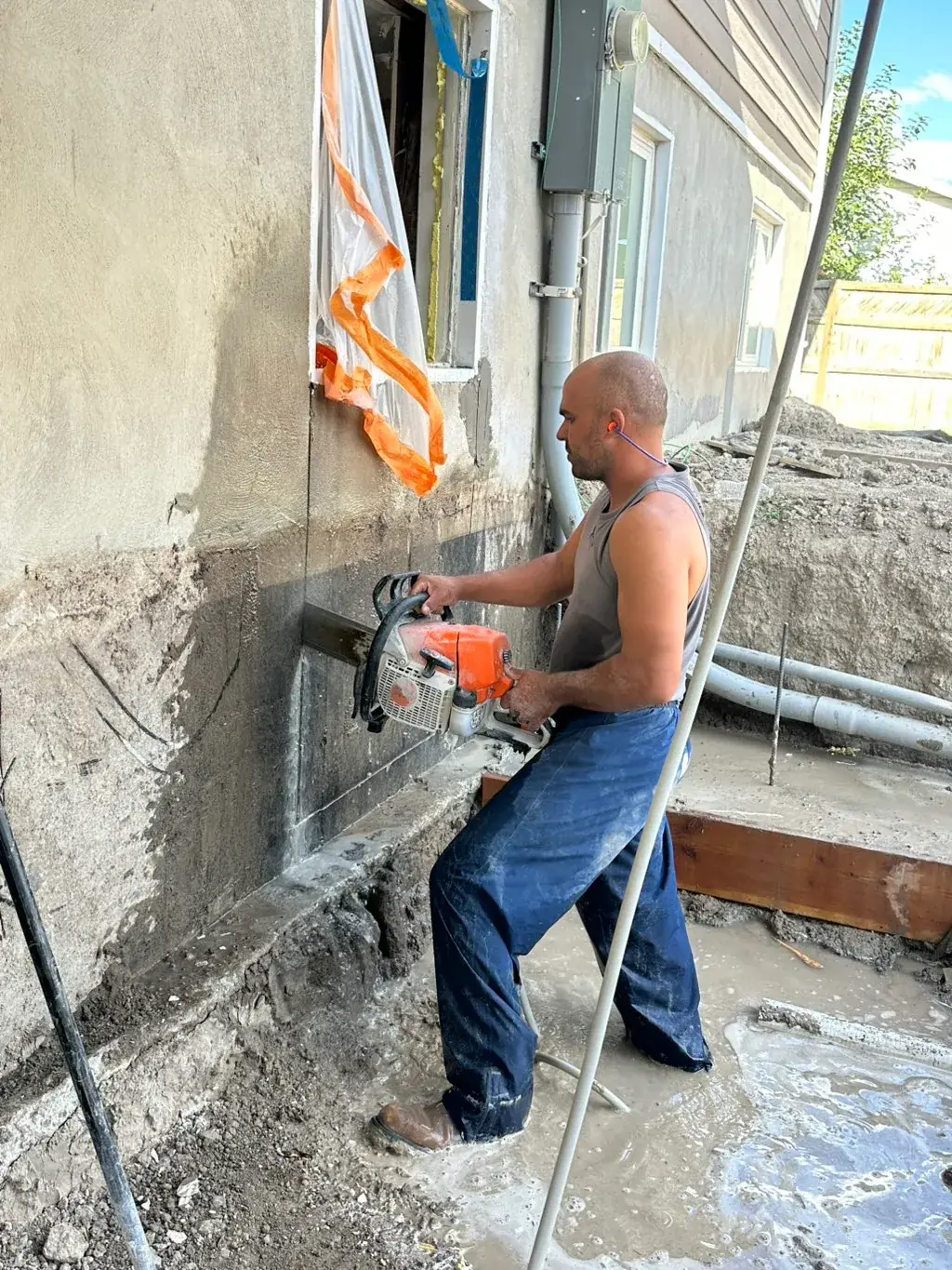 Saw cutting a concrete wall by MD Concrete in Utah