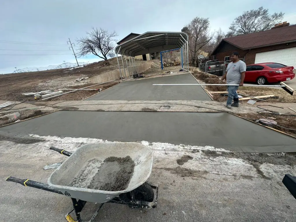Crew finishing a new slab by MD Concrete in Utah