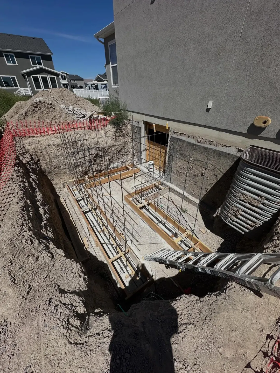 Walkout footing forms beside a home by MD Concrete in Utah