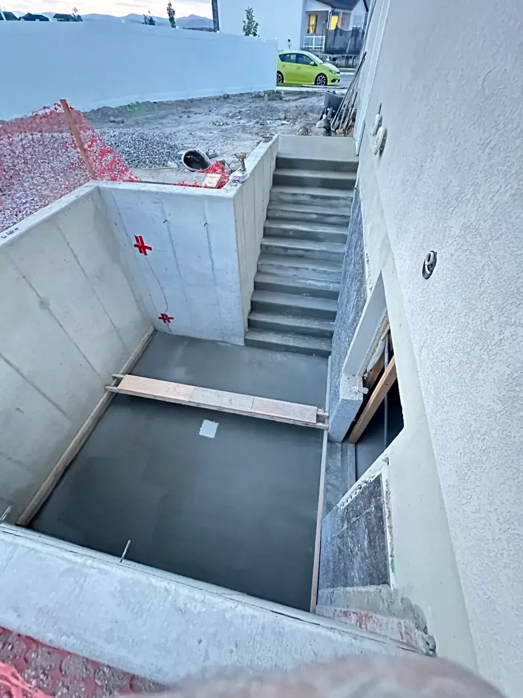Walkout steps down to a basement by MD Concrete in Utah