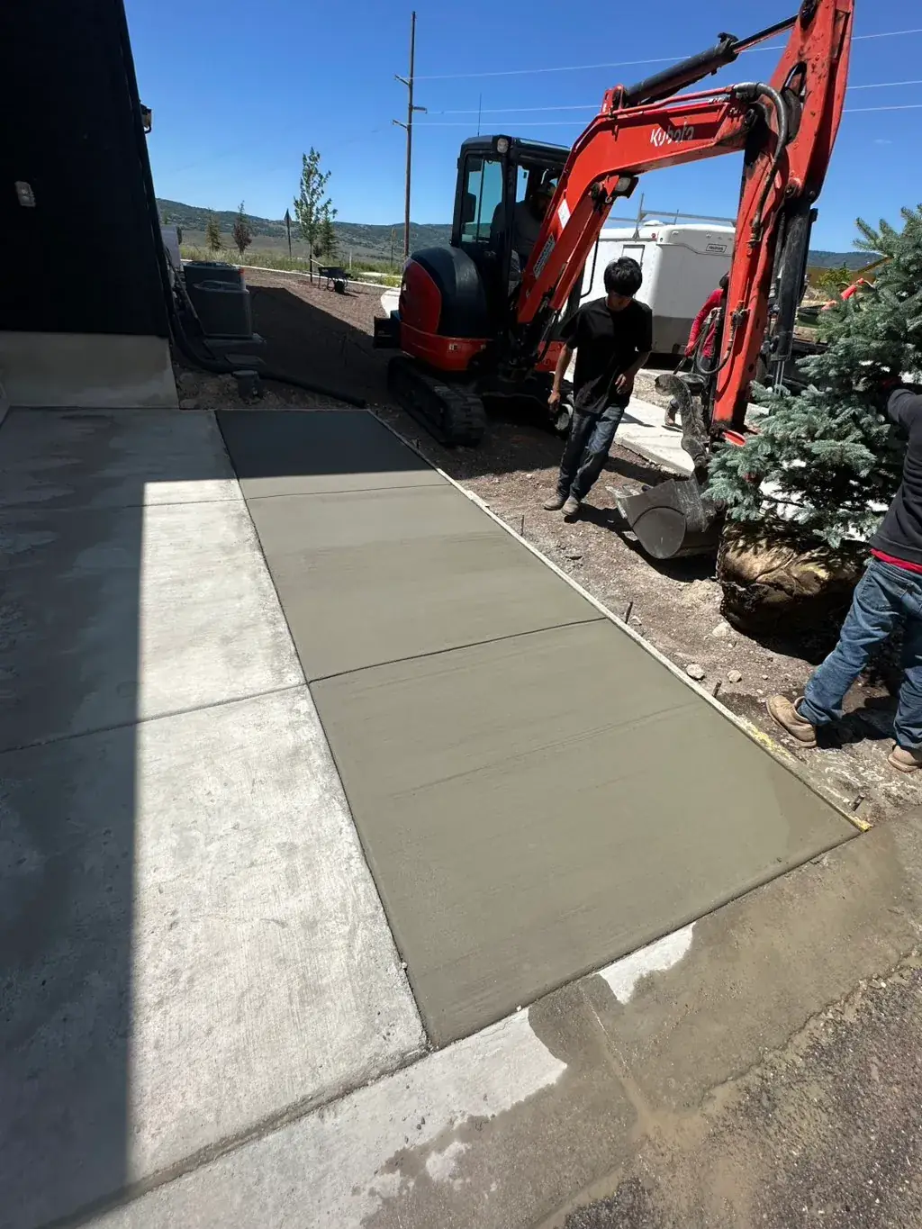 Fresh slab beside a dig site by MD Concrete in Utah