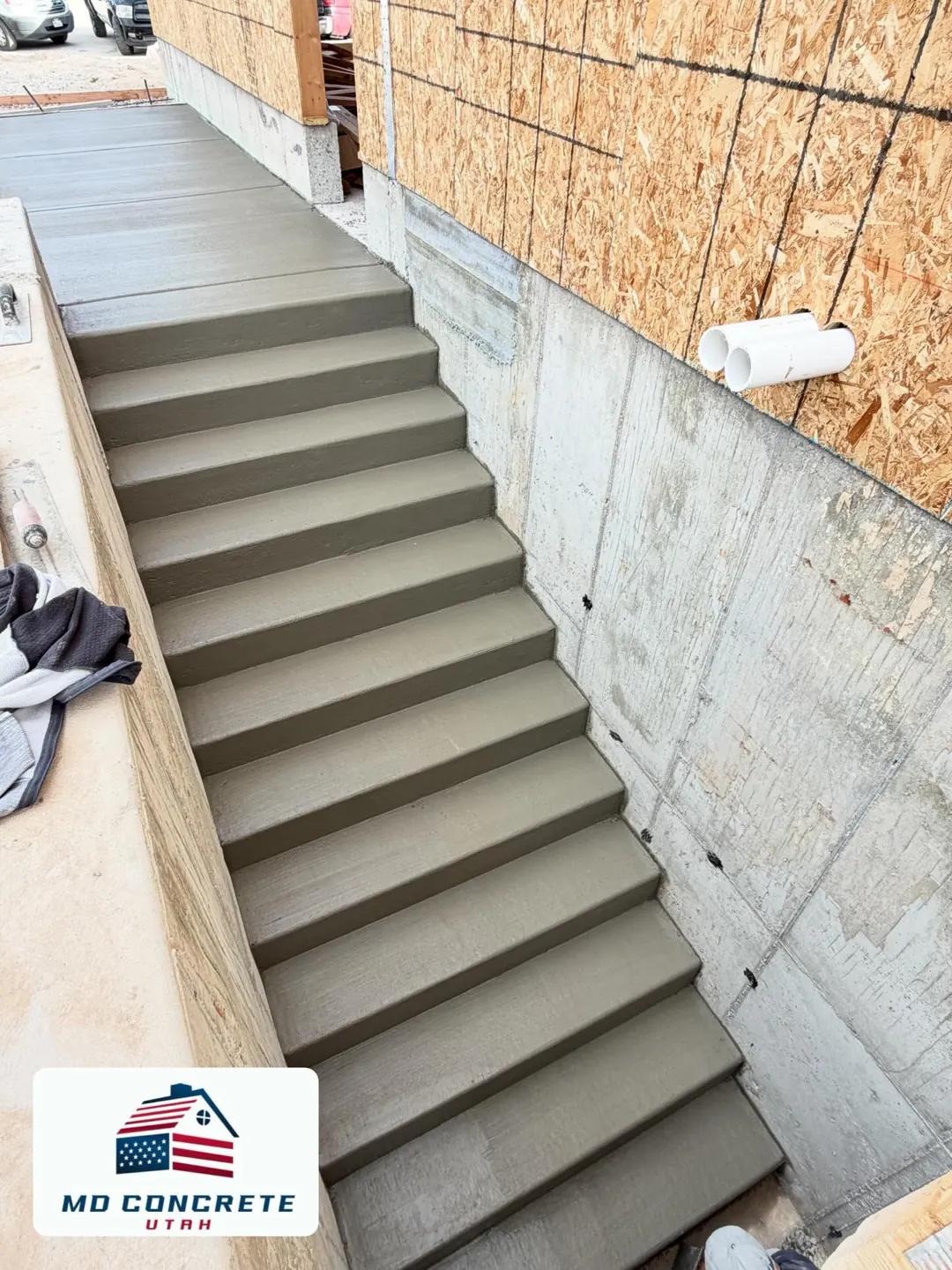 Finished concrete steps beside a home by MD Concrete in Utah