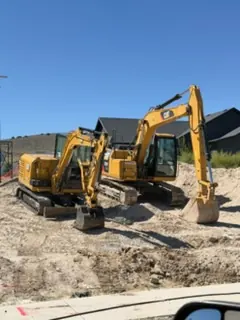 Excavators preparing a job site by MD Concrete in Utah