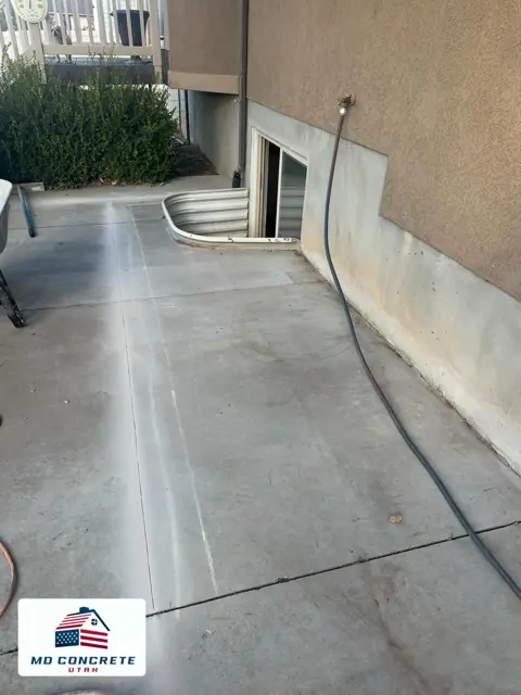 Concrete patio beside a home by MD Concrete in Utah