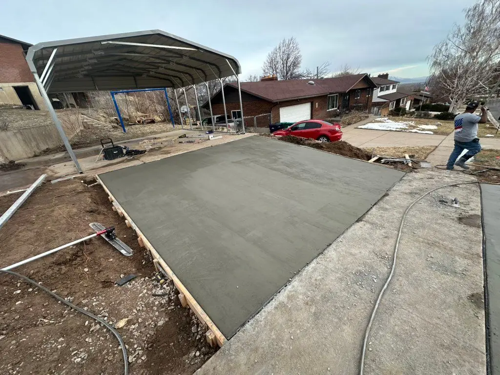 Big slab poured under a carport by MD Concrete in Utah
