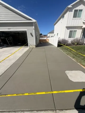 New driveway with clean cut lines by MD Concrete in Utah