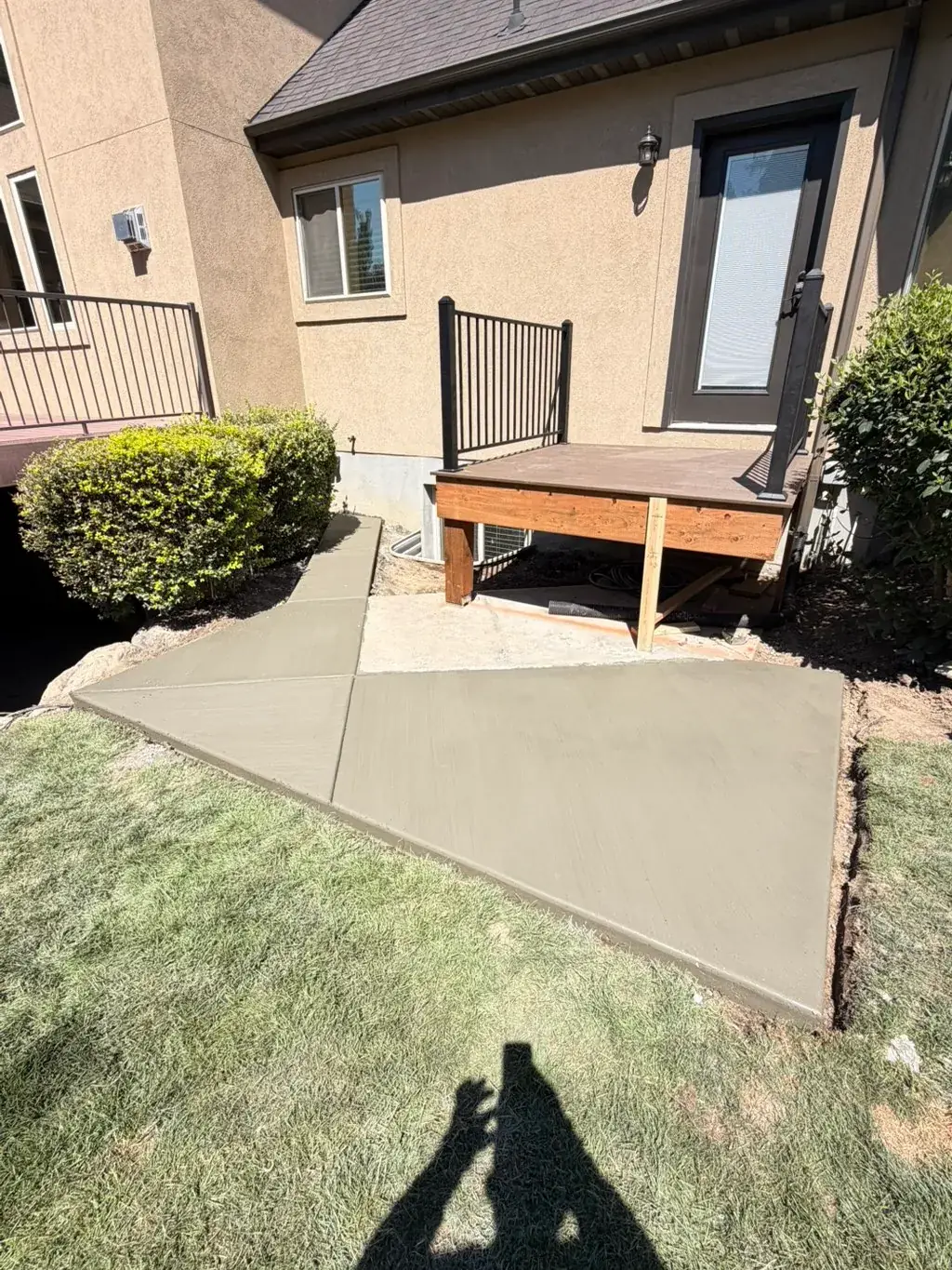 Small patio by a back deck by MD Concrete in Utah