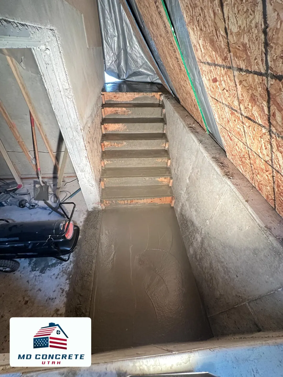 Fresh landing below basement steps by MD Concrete in Utah
